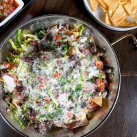★Nachos · Loaded with tender meat (Asada or Chicken), queso fresco, refired beans, Pico  de Gallo, jal...