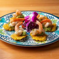 Tostones con Camarones · Shrimp served with fried plantains, guacamole & onions.