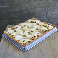 White Pesto Pizza · Mozzarella cheese, ricotta, and pesto sauce.
