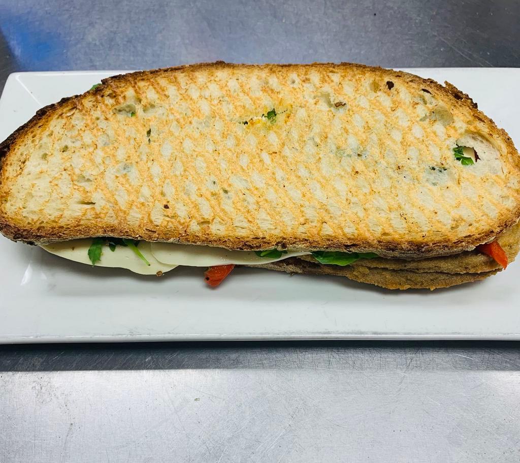 PS8. Jacqueline Panini · Grilled chicken tossed in our signature Buffalo sauce, baby spinach, tomato, fresh mozzarella and blue cheese dressing.