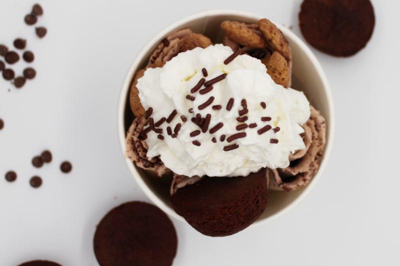 9. Brownie Bite · Base; vanilla mix-in; brownie bite topping; brownie bite, cookie bites cereal, and chocolate sprinkle other; whipped cream.