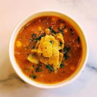 Chicken Tortilla Soup · A traditional Mexican favorite with chicken, in a broth of tomato, garlic, onion, chilies, e...