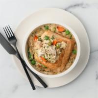 Chicken Pot Pie · An Automat classic remade. Roasted chicken and vegetables in a cream gravy topped with golde...