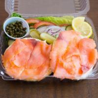 Center Slice Hand-cut Lox · Bagel, lox, cream cheese, lettuce, tomato, onion, cucumber, capers, pickles and lemon.