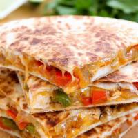 The World Famous Chicken Quesadilla · Flavorful grilled chicken, grilled onions, sauteed bell peppers, 4 cheeses (Monterey Jack, c...