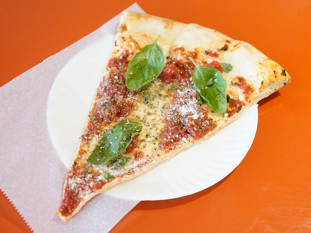 Margarita Pizza · Fresh mozzarella cheese, fresh basil and crushed tomato. No sauce.
