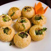 Batata Sev Puri · Potatoes and chickpeas fillings topped with yogurt and chutneys and fresh cilantro