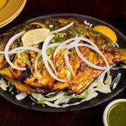 Tandoori Pomfret · Pomfret marinated in cumin-coriander paste, roasted in tandoor oven, and served with onions,...