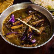 Khatte Meethe Baingan · Baby eggplant in tangy tamarind sauce topped with ginger.