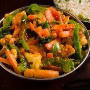 Vegetable Jalfrezi · Veggies tossed in tangy onion and tomato sauce prepared with gram masala and topped with gin...