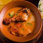 Purani Delhi Ka Butter Chicken · Bone-in chicken prepared in an Old-Delhi style buttery and creamy gravy
