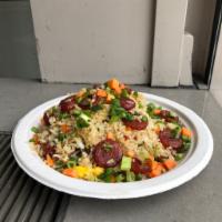 Sweet Sausage Fried Rice · Eggs, Peas, Carrots, Onion, and Scallions
