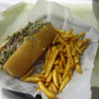 Philly Cheesesteak Sandwich · Served with peppers, onions, mushrooms and American cheese on a sub roll.
