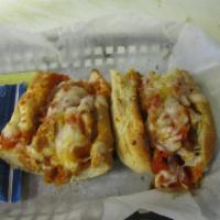 Chicken Parm Sandwich · Crispy chicken covered in marinara and mozzarella on a sub roll, finished in the oven.