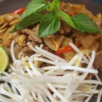 Pad Kee Mao · Wide rice noodles stir-fried with egg, onions, bell peppers, fresh chili, garlic, and basil ...