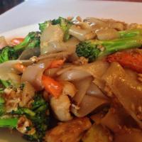 Pad See Ew · Wide rice noodles stir-fried with broccoli, carrot, and egg, with sweet soy sauce top with b...