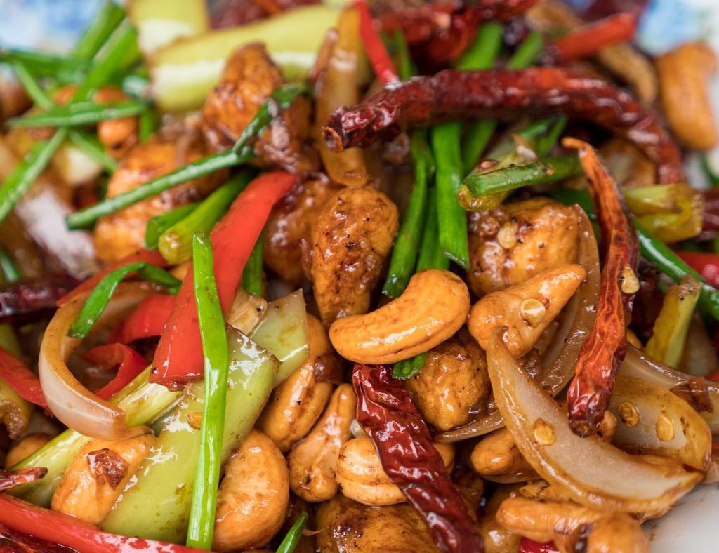 Pad Cashew · Stir-fried choice of meat with chili paste, bell peppers, carrot, cashew nuts, onions, and green onion. 