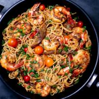 Linguine Pescatore · Calamari, shrimp, scallops, fresh garlic, tomato, and basil. 