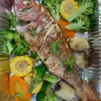 17. Whole Red Snapper · It will take 45 minutes to grill. Pargo rojo.
with broccoli potato and corrots