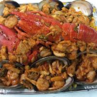 Seafood with Yellow Rice for 8 People · Paella de mariscos. Serves for 8 people. Come with 1 lobster, 6 crabs, 6 clams, shrimps and ...