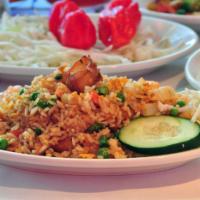 Seafood Fried Rice · Shrimp, snapper, crab meat and vegetables.  Your choice of rice. 