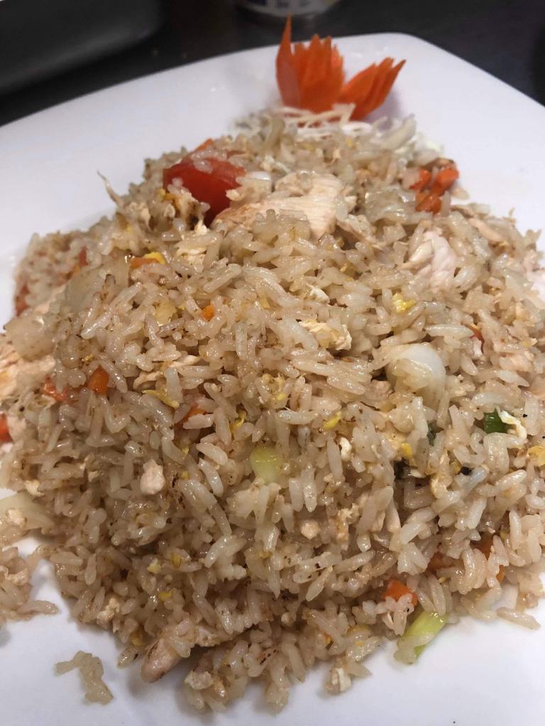 36. Chicken Fried Rice · Stir fried jasmine rice with egg, onion, tomato, carrot and scallion.