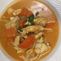38. Chicken Red Curry · Bamboo shoots, sweet basil, bamboo shoot, eggplant and carrot simmered in coconut milk.