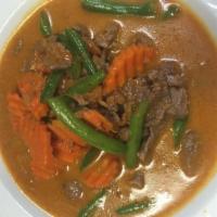 39. Chicken Panang · Our rich red curry of beef simmered in coconut milk, green beans, carrot and kaffir lime lea...