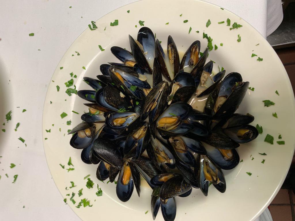 Zuppa di Mussels · Steamed mussels in white wine or a light tomato sauce. Gluten free.