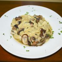 Homemade Pappardelle Pasta Dinner · Wild mushrooms and garlic oil sauce.