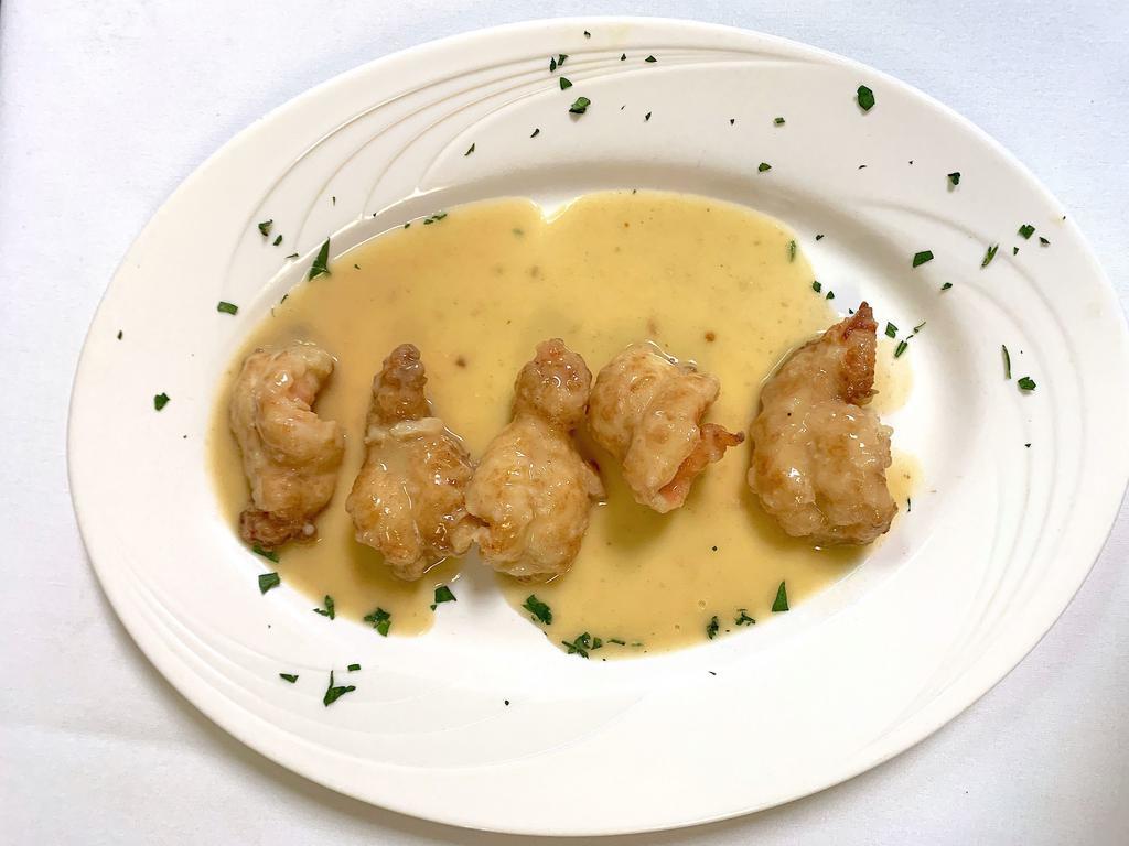 Shrimp al Vino Bianco · Delicately floured sauteed shrimp with garlic and white wine, served with choice of side.
