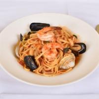 Linguine Frutti di Mare Dinner · Clams, lobster tail, calamari, mussels and shrimp with red sauce over linguini.
