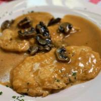 Chicken Marsala · Sauteed chicken breast in a Marsala white wine sauce and mushrooms, served with a side of ve...