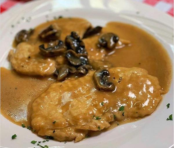 Chicken Marsala · Sauteed chicken breast in a Marsala white wine sauce and mushrooms, served with a side of vegetables. Gluten free.