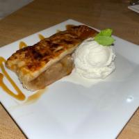 Apple Strudel · Pastry dough, stuffed with fresh apples, and baked, served with a scoop of vanilla ice cream
