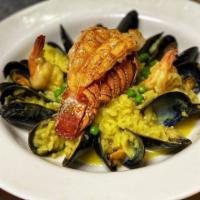 Seafood Risotto · Arborio Italian rice with mixed seafood, including lobster tail, clams, mussels, calamari, a...