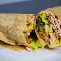 Grilled Chicken Caesar Wrap · Sliced grilled chicken breast served on a garlic herb wrap with romaine lettuce, creamy Caes...