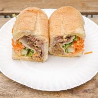 Traditional Banh Mi Sandwich · Vietnamese ham, liver pate and roasted ground pork. Served with crispy pickled carrots and d...