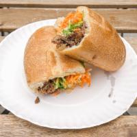 Beef Short Ribs Banh Mi Sandwich · Slow-braised in lemongrass, spices and soy sauce. Served with crispy pickled carrots and dai...
