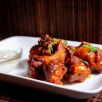 Holiday Wings · choice of naked, soy-glazed  or spicy buffalo hot with house-made ranch.