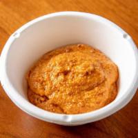 Red Coconut Chutney · Coconut flakes, green chili, lentils, spices