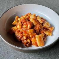 Rigatoni Bolognese · Home made rigatoni, beef and veal slowly cooked in a classic bolognese sauce