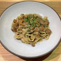 Fettuccine with Porcini · Home made fettuccine with fresh porcini mushrooms slowly cooked in a white wine sauce with g...