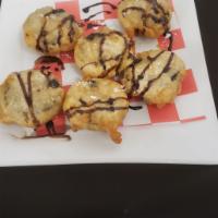 Fried Oreos  · Topped with chocolate and caramel syrup. Dusted with powdered sugar. 