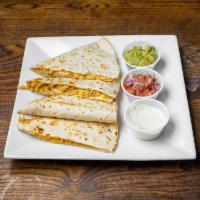 Quesadilla  · Large tortilla filled with Monterey Jack and cheddar cheese grilled to gooey perfection. Acc...
