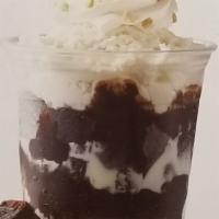 12 oz. Fudge Brownie Delight Sundae · Vanilla ice cream, fudge brownies, hot fudge, whipped cream, chopped peanuts and cherry.