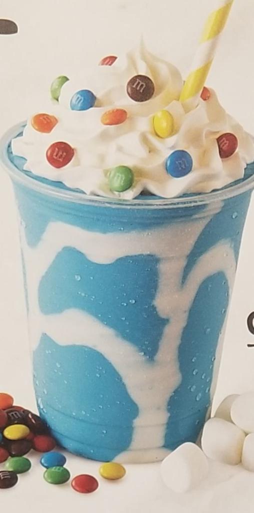 Cotton Candy Ice Cream Milk Shake · Blue cotton candy ice cream, M&M's, whipped cream and marshmallow creme.