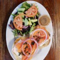 Deluxe Bagel · Served with nova Scotia lox, cream cheese, lettuce, tomato, onions and cucumbers.
