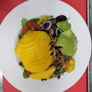 Mango Salad · Mixed greens, tomato, cucumbers, green peppers, onions, dried cranberries, walnuts, avocado and mango.