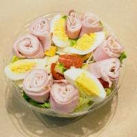 Chef's Salad · Sliced roast turkey, ham, Swiss and American cheese, sliced egg and tomatoes on a bed of cri...